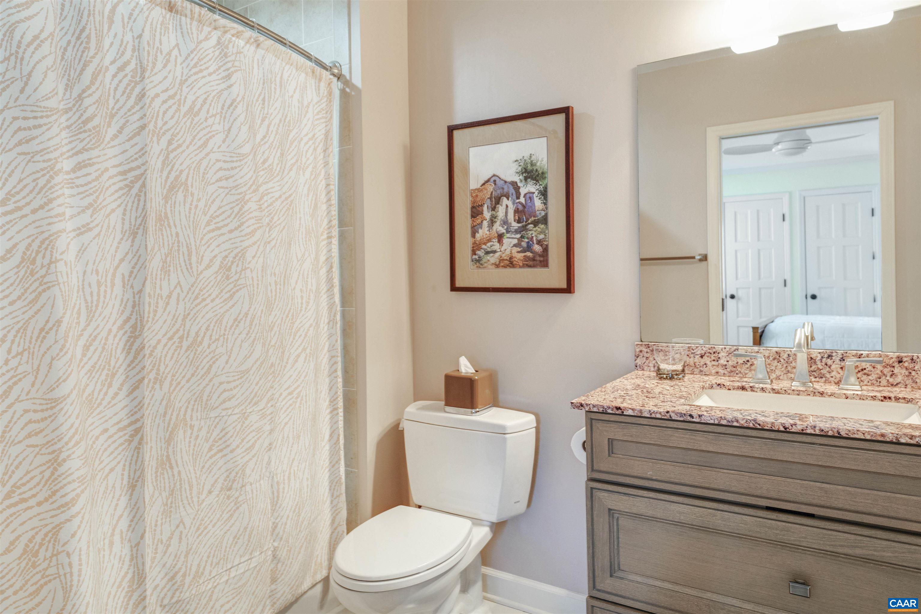 2330 Whippoorwill Road Charlottesville, VA 22901 - Photo 36 of 62 a bathroom with a toilet sink and mirror