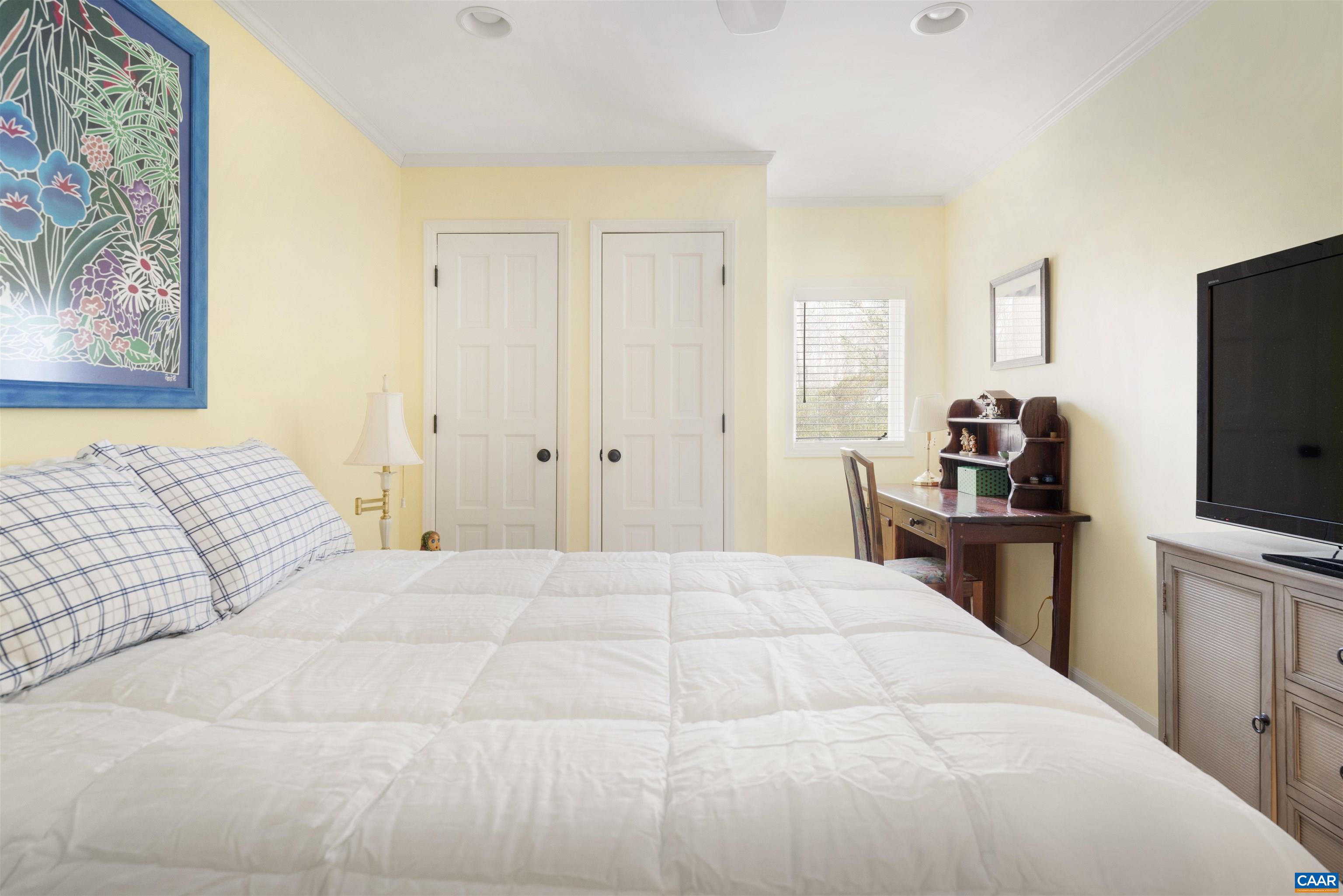 2330 Whippoorwill Road Charlottesville, VA 22901 - Photo 38 of 62 a bedroom with a bed and a flat screen tv
