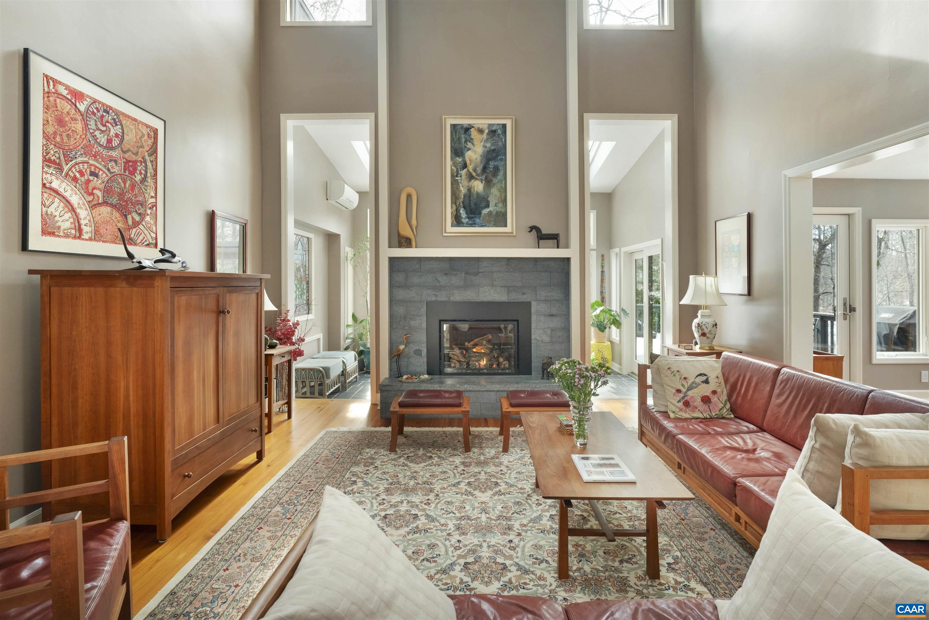 2330 Whippoorwill Road Charlottesville, VA 22901 - Photo 6 of 62 a living room with furniture and a fireplace