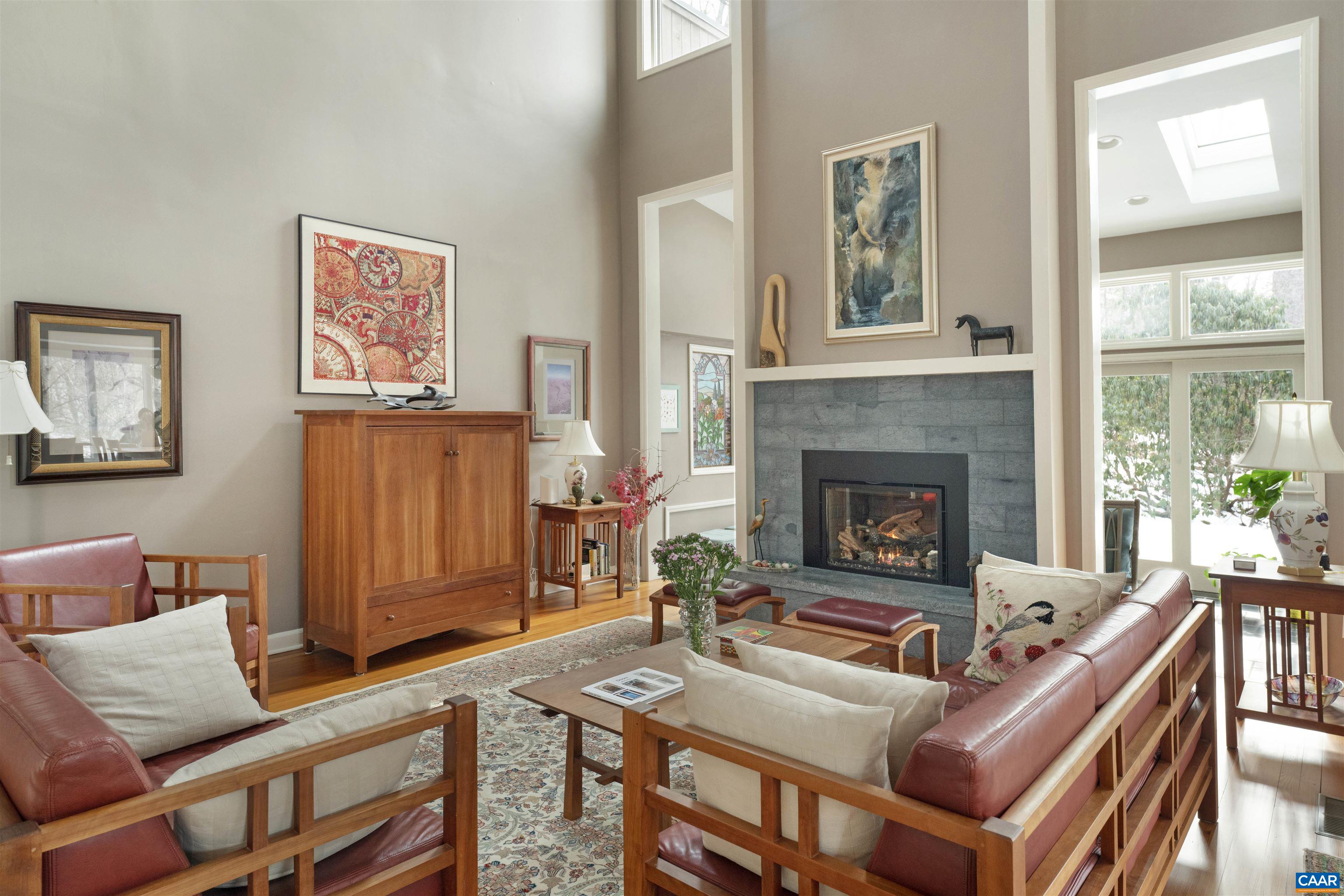 2330 Whippoorwill Road Charlottesville, VA 22901 - Photo 7 of 62 a living room with furniture and a fireplace