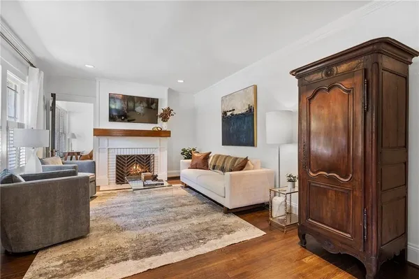 a dining room with furniture and wooden floor