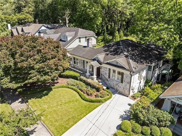 an aerial view of a house with a swimming pool