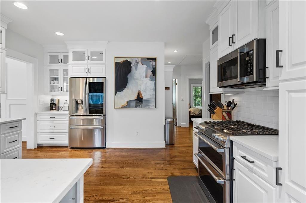 663 Yorkshire Road Northeast Atlanta, GA 30306 - Photo 28 of 85 a kitchen with stainless steel appliances a refrigerator stove and microwave