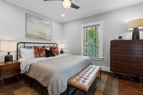 a front view of a house with a yard and green space