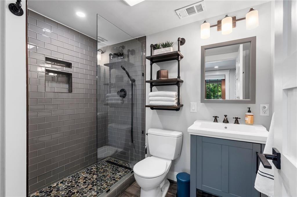 663 Yorkshire Road Northeast Atlanta, GA 30306 - Photo 73 of 85 a bathroom with a sink toilet and shower