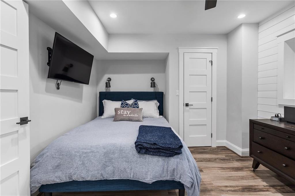 663 Yorkshire Road Northeast Atlanta, GA 30306 - Photo 76 of 85 a bedroom with a bed and a flat screen tv