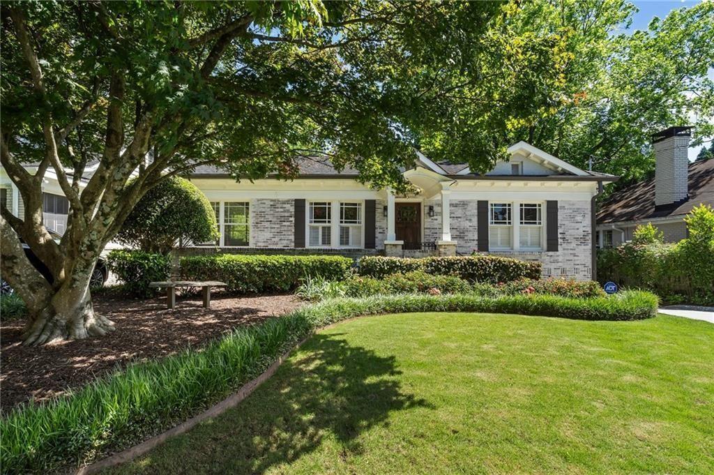 663 Yorkshire Road Northeast Atlanta, GA 30306 - Photo 81 of 85 a front view of a house with a yard and green space