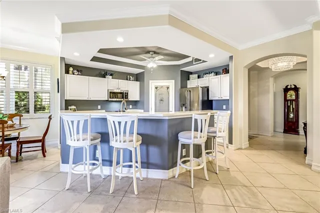 a view of a dining area with furniture and a chandelier