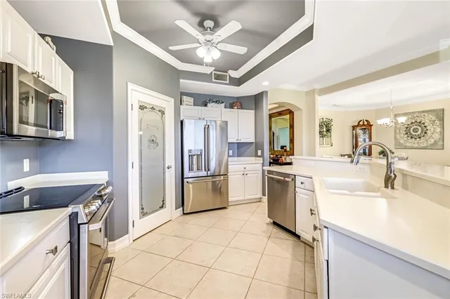 a kitchen with a stove a sink and a refrigerator