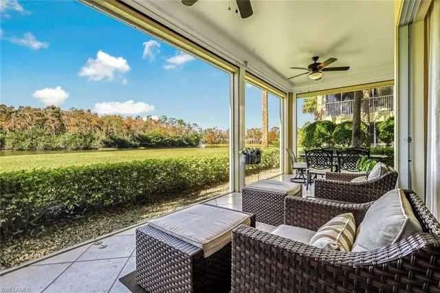 a view of a patio with couches and pool