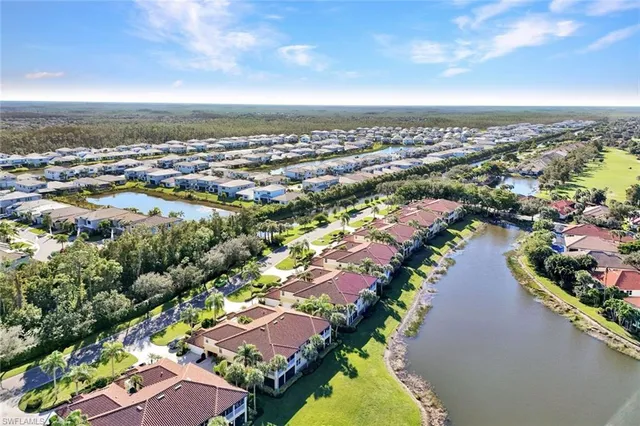 an aerial view of a house with a lake view