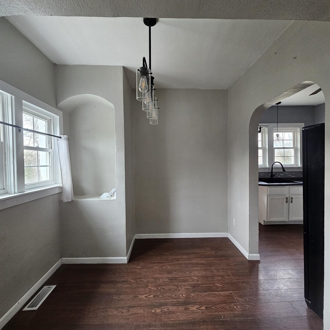 14027 North Link Lane Mount Vernon, IL 62864 - Photo 13 of 28 a view of a room with a hardwood floor and a ceiling fan