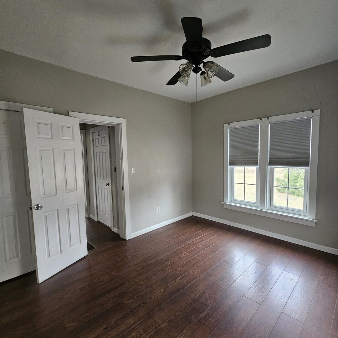 14027 North Link Lane Mount Vernon, IL 62864 - Photo 16 of 28 a view of an empty room with wooden floor and a window