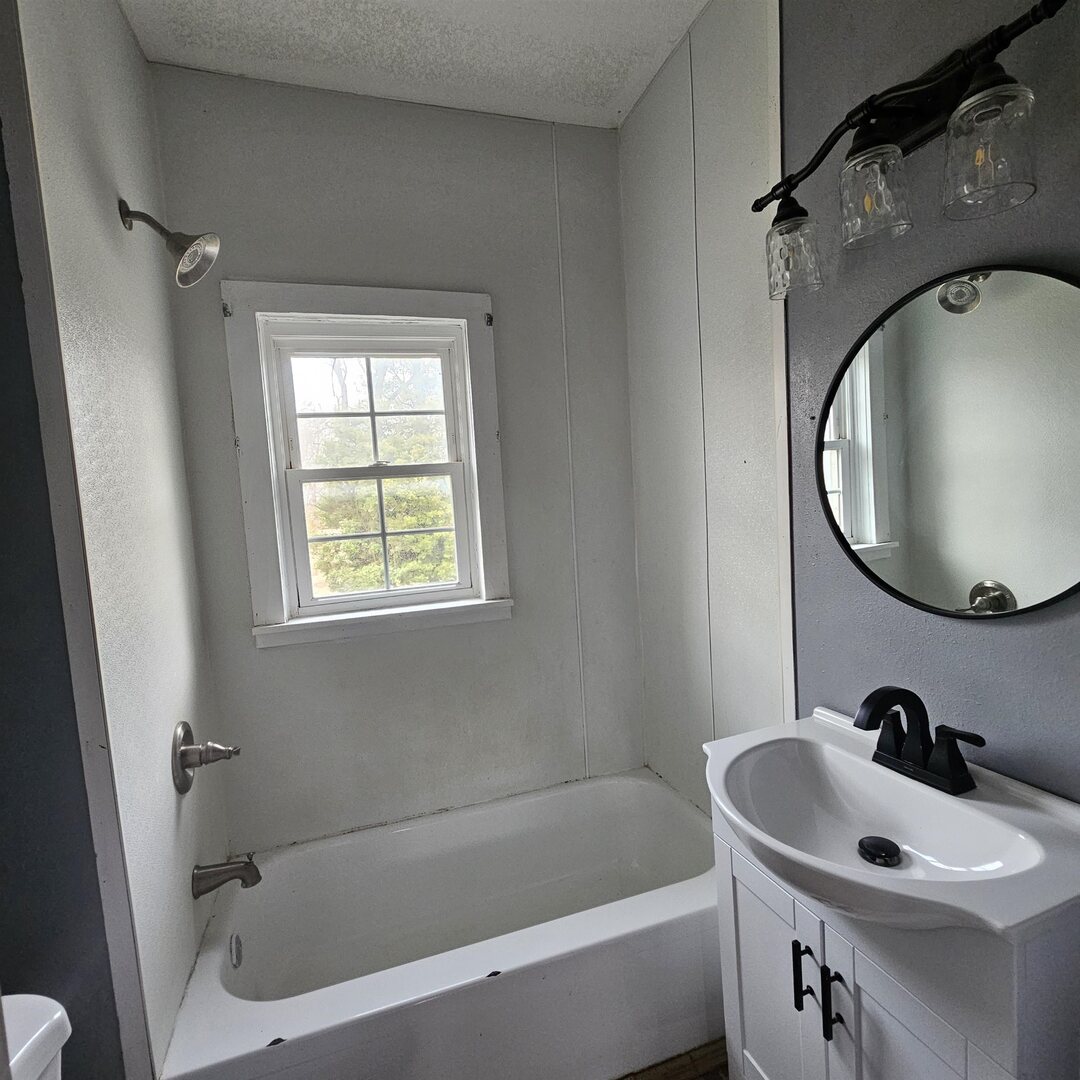 14027 North Link Lane Mount Vernon, IL 62864 - Photo 18 of 28 a bathroom with a sink and a mirror