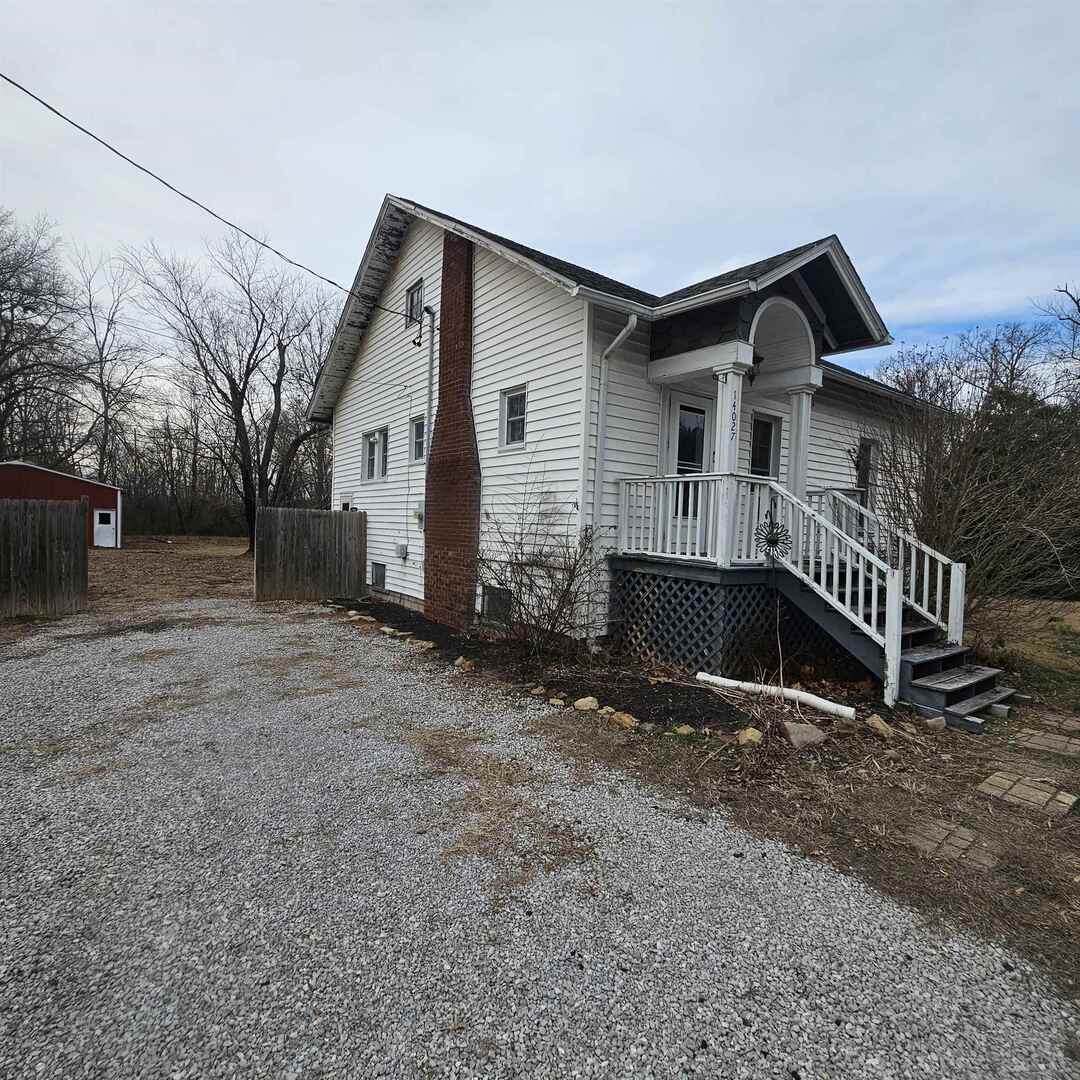 14027 North Link Lane Mount Vernon, IL 62864 - Photo 5 of 28 a backyard of a house with a yard and garage