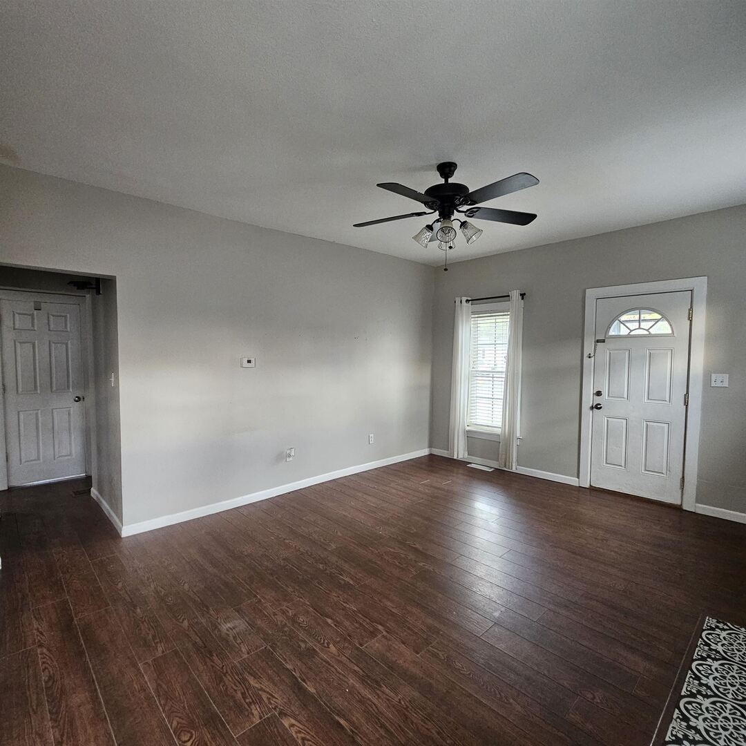 14027 North Link Lane Mount Vernon, IL 62864 - Photo 8 of 28 a view of an empty room with wooden floor and a ceiling fan