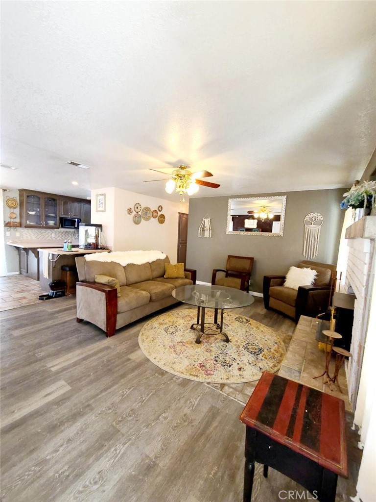 8725 Monte Vista Road Phelan, CA 92371 - Photo 12 of 31 a living room with furniture and a table