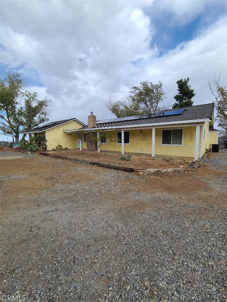 8725 Monte Vista Road Phelan, CA 92371 - Photo 2 of 31 a view of a house with a backyard
