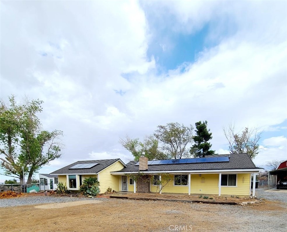 8725 Monte Vista Road Phelan, CA 92371 - Photo 31 of 31 a front view of a house with a garden
