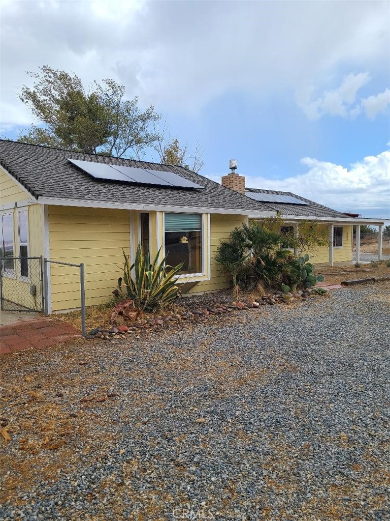 8725 Monte Vista Road Phelan, CA 92371 - Photo 5 of 31 a view of a house with a garden