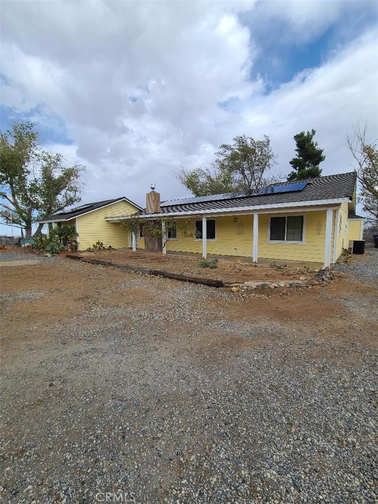 8725 Monte Vista Road Phelan, CA 92371 - Photo 6 of 31 a view of a house with a backyard