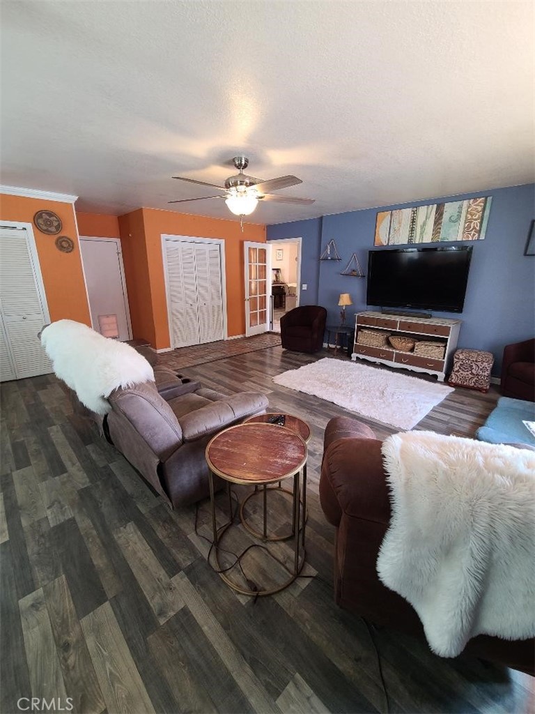 8725 Monte Vista Road Phelan, CA 92371 - Photo 10 of 31 a living room with furniture and a flat screen tv