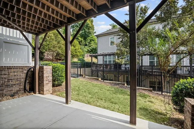 a roof deck with table and chairs