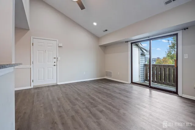 a view of a balcony with wooden floor