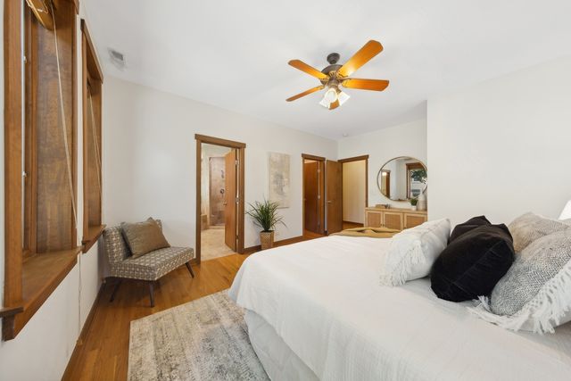 a bedroom with a bed and a couch