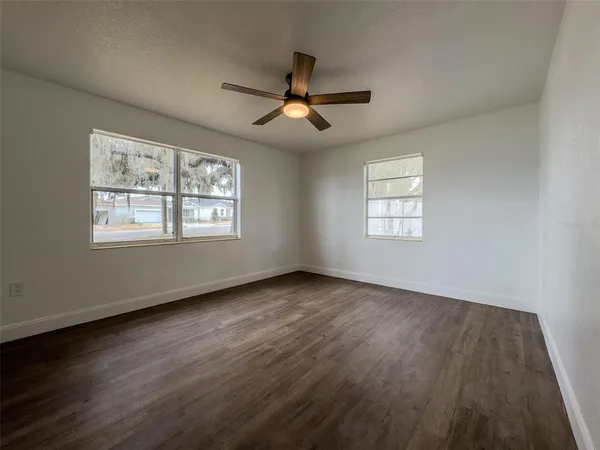 a view of a room with a bench and a window