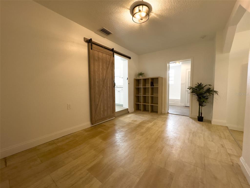 1047 Clay Boulevard Eustis, FL 32726 - Photo 19 of 33 an empty room with furniture and a window