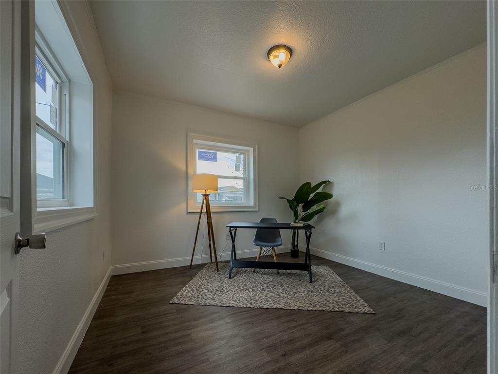 1047 Clay Boulevard Eustis, FL 32726 - Photo 23 of 33 a view of a workspace with furniture and a window
