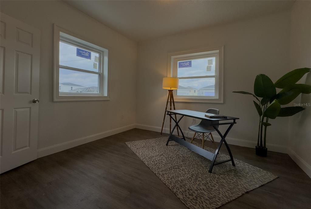 1047 Clay Boulevard Eustis, FL 32726 - Photo 25 of 33 a workspace room with furniture and a potted plant