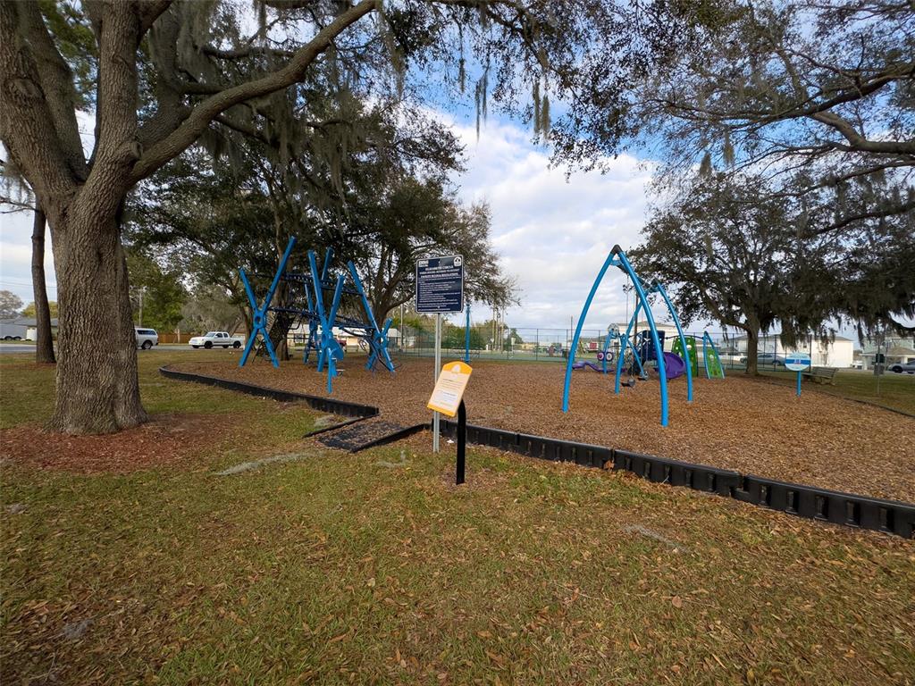 1047 Clay Boulevard Eustis, FL 32726 - Photo 31 of 33 a park view with a slide