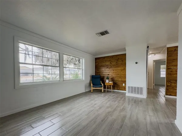 a view of an empty room with a window