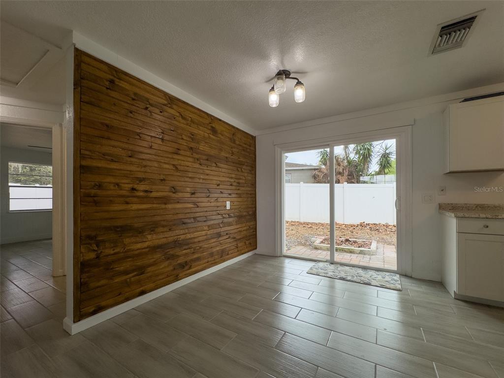 1047 Clay Boulevard Eustis, FL 32726 - Photo 7 of 33 a view of an empty room with a window
