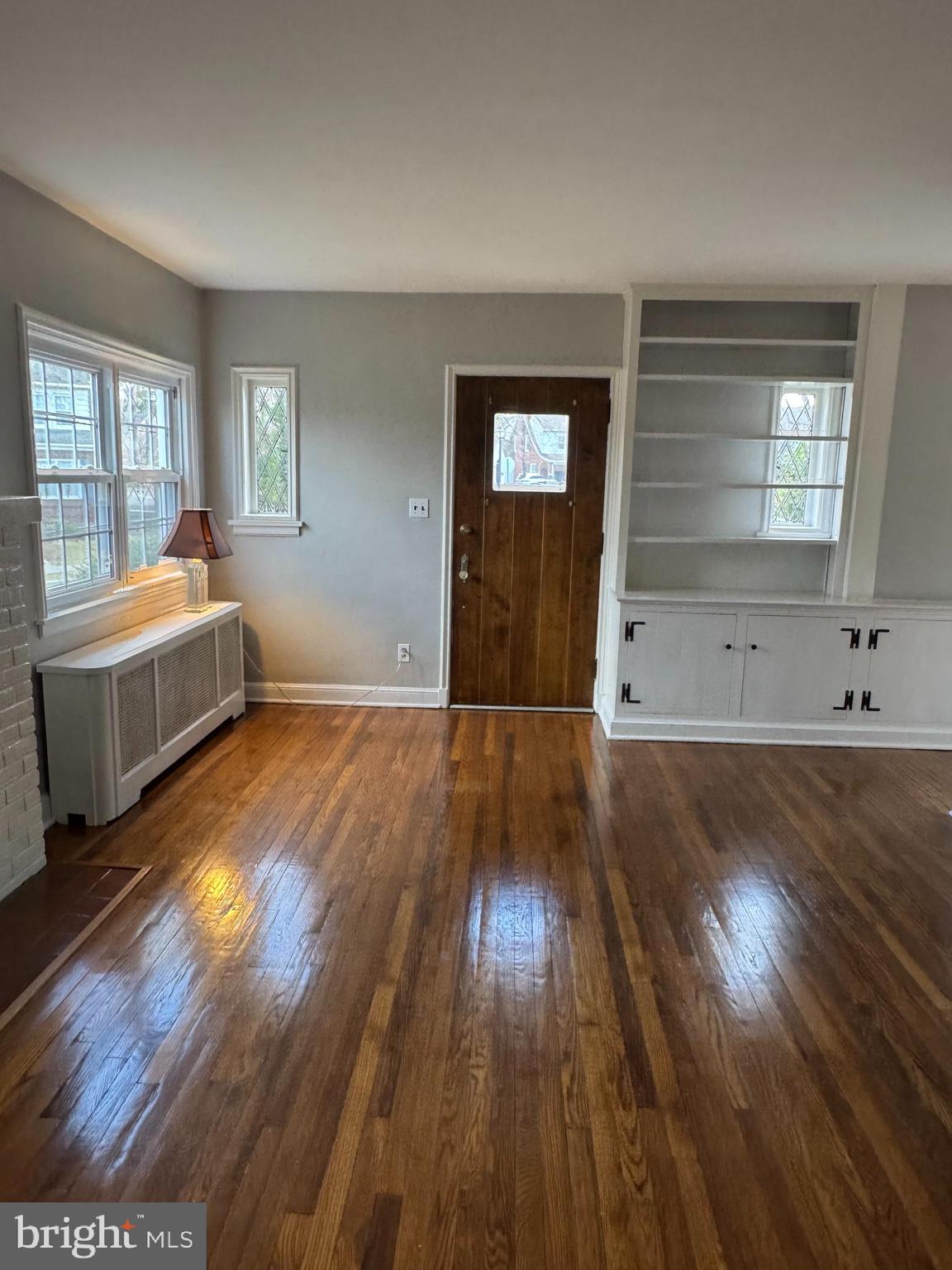 102 Harvard Boulevard Reading, PA 19609 - Photo 4 of 11 wooden floor in an empty room with a window
