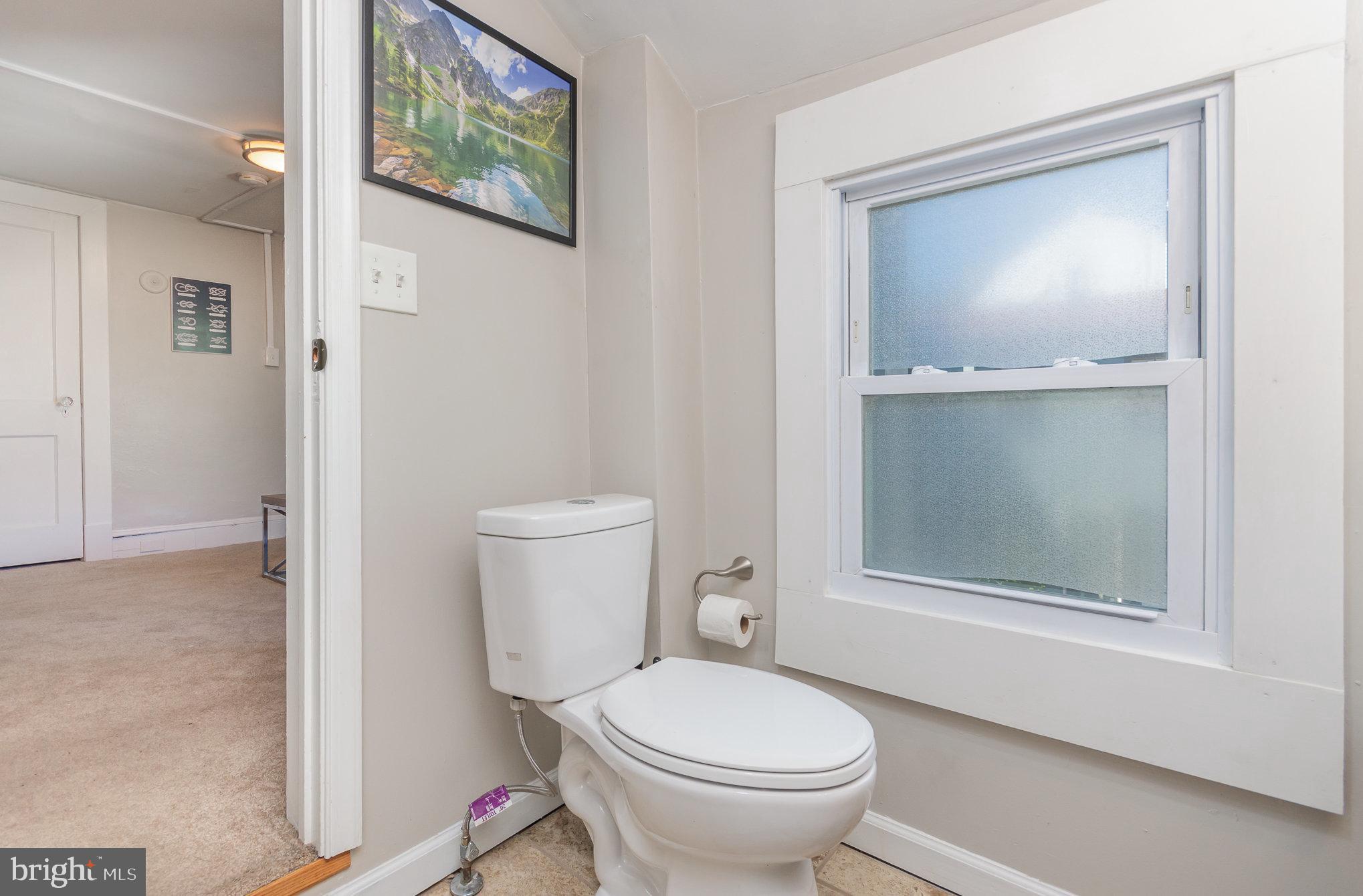 126 Prince George Street, Unit 4 Annapolis, MD 21401 - Photo 11 of 12 a bathroom with a toilet and a sink