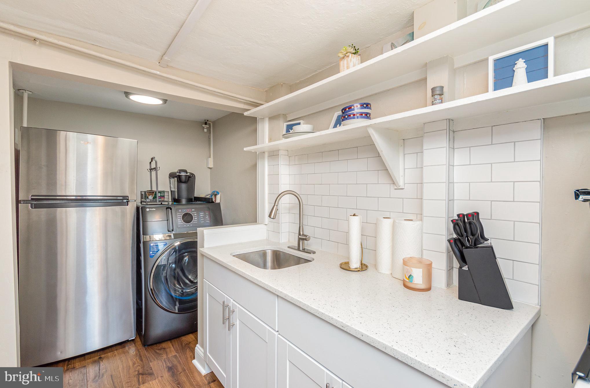 126 Prince George Street, Unit 4 Annapolis, MD 21401 - Photo 5 of 12 a kitchen with a refrigerator and a sink