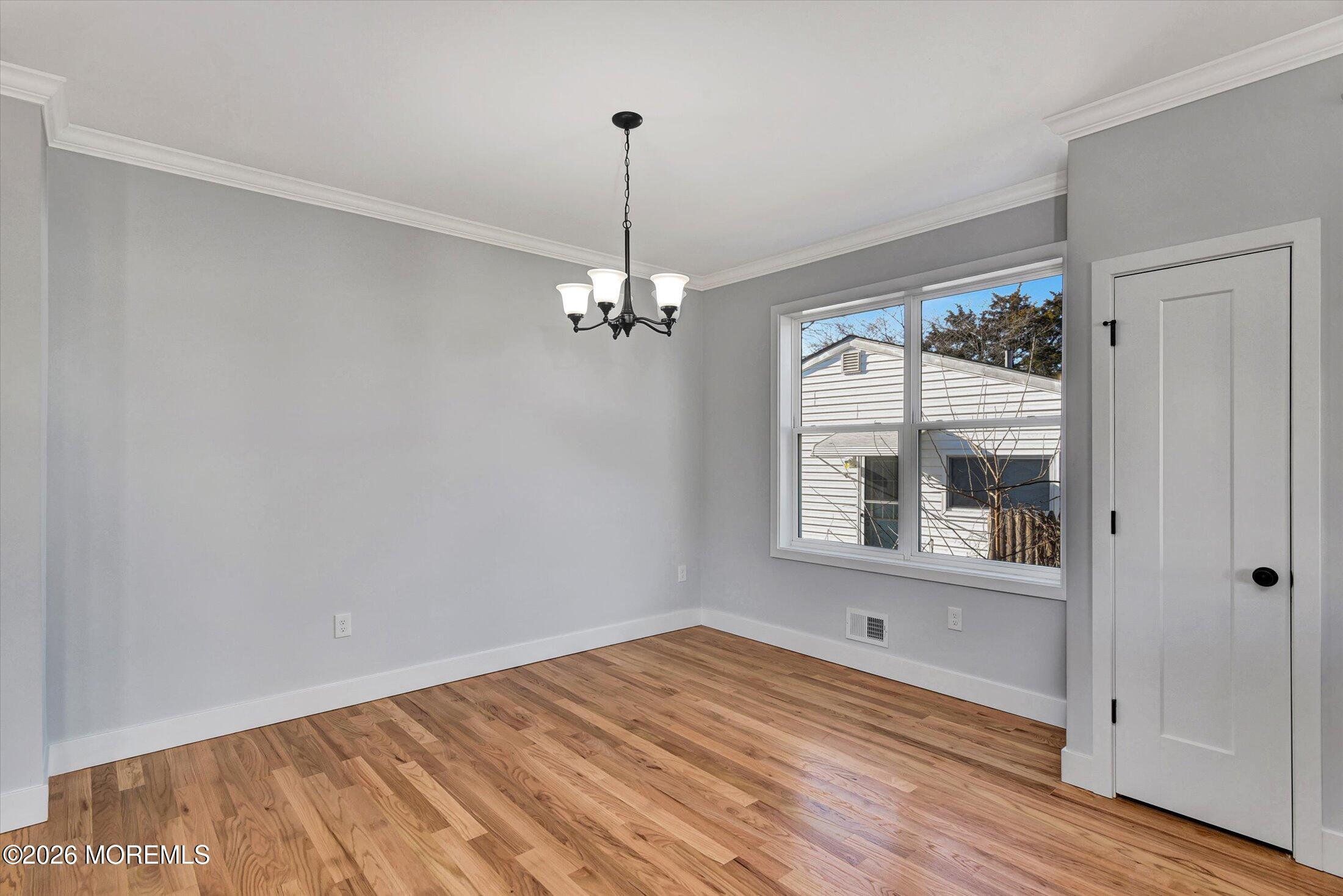 910 Malden Drive Keyport, NJ 07735 - Photo 12 of 38 a view of empty room with wooden floor and fan