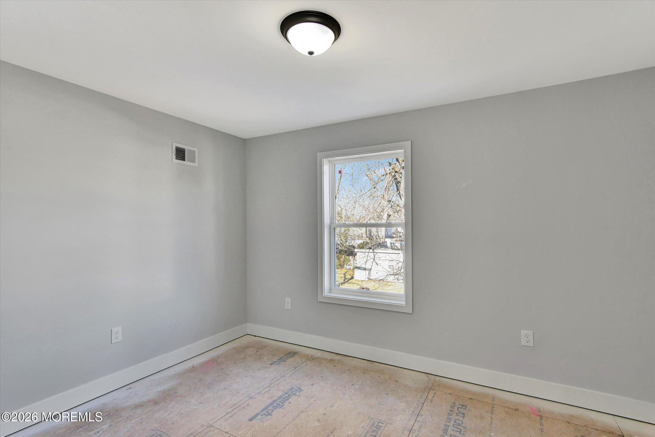 910 Malden Drive Keyport, NJ 07735 - Photo 32 of 38 an empty room with windows