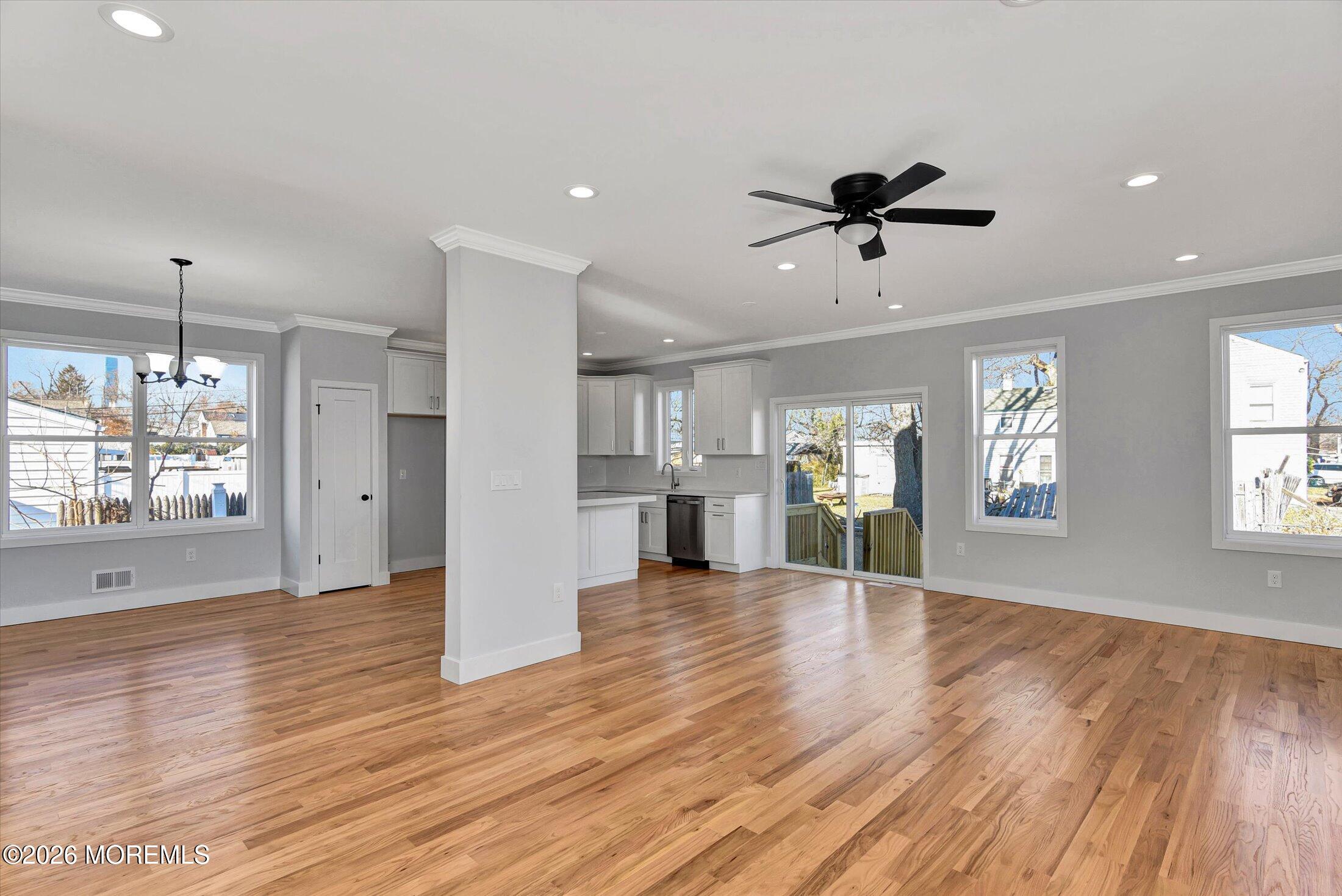910 Malden Drive Keyport, NJ 07735 - Photo 7 of 38 a view of an empty room with wooden floor and a window