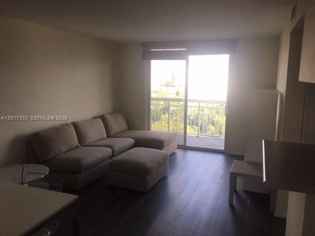 816 Northwest 11th Street, Unit 1104 Miami, FL 33136 - Photo 1 of 7 a living room with furniture and a window