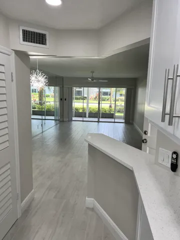 a room with a bed and a large window