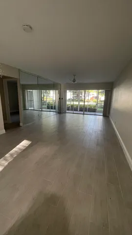 a view of an empty room with windows