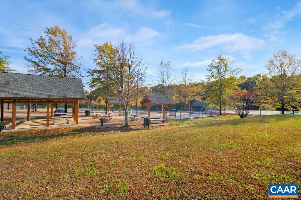 8073 Chestnut Grove Road Esmont, VA 22937 - Photo 30 of 30 a view of a large pool with an outdoor space and seating area