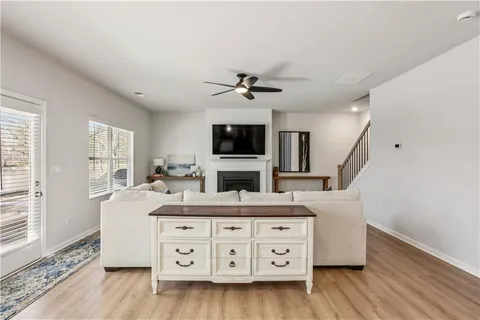a spacious bathroom with a double vanity sink a mirror and a bathtub