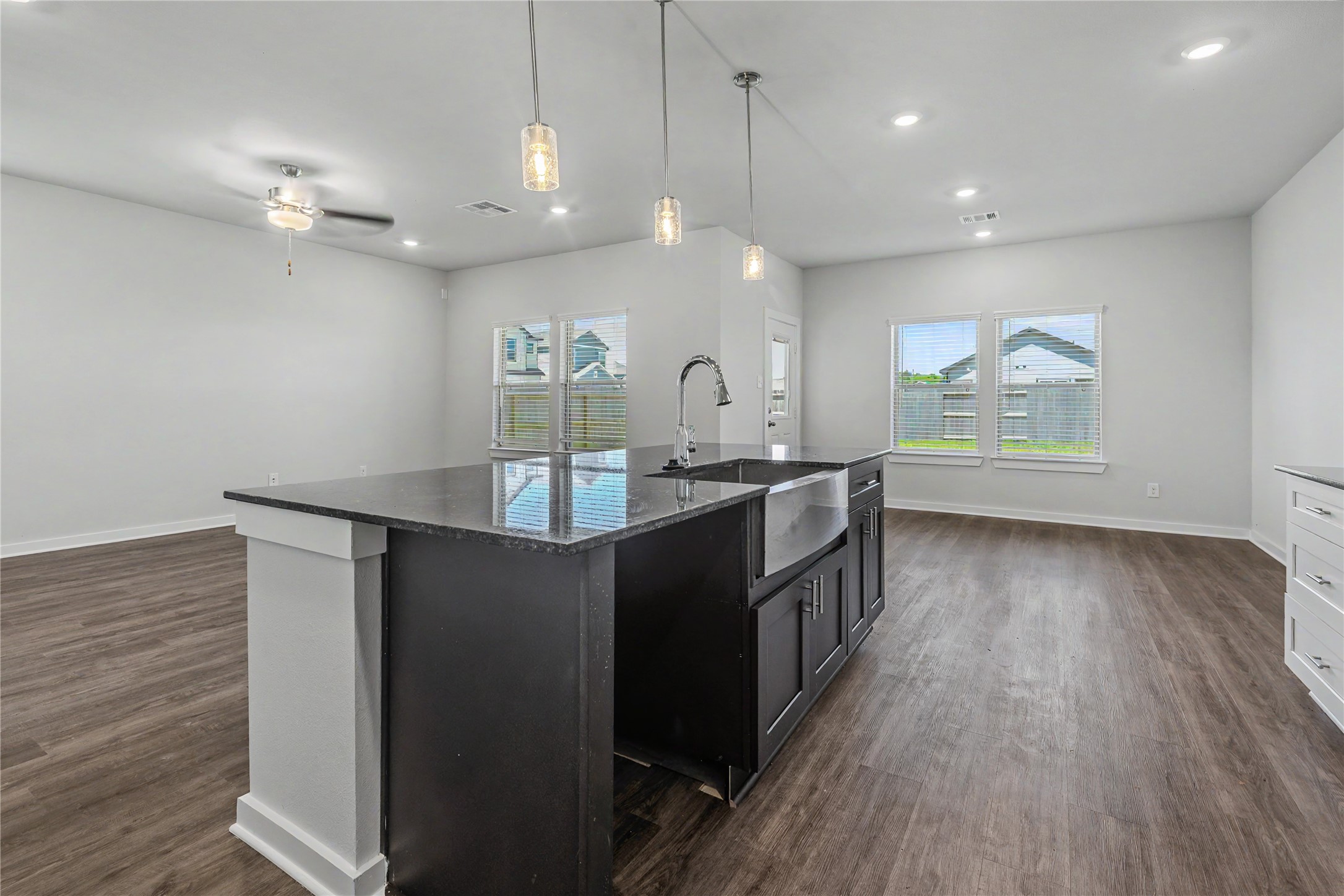 6426 Bolinas Court Rosharon, TX 77583 - Photo 15 of 49 a kitchen with kitchen island a sink and a stove top oven