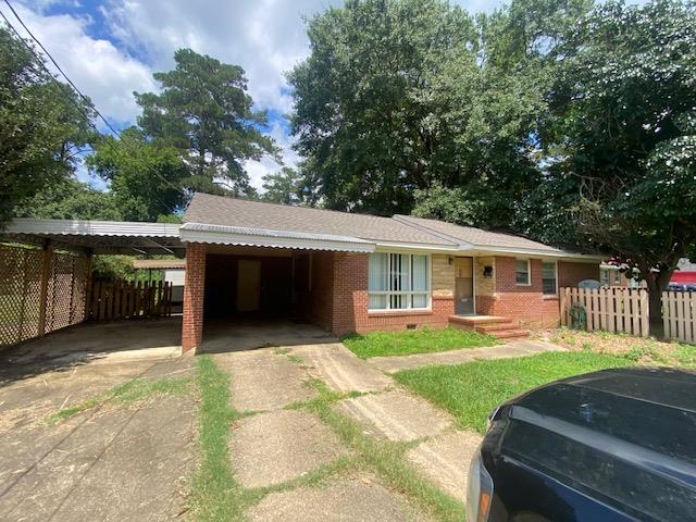 3015 Hendrix Street Columbus, GA 31903 - Photo 2 of 8 a front view of a house with a yard porch and patio