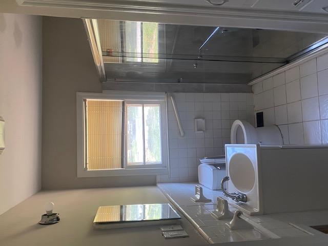 3015 Hendrix Street Columbus, GA 31903 - Photo 4 of 8 a bathroom with a sink and a mirror